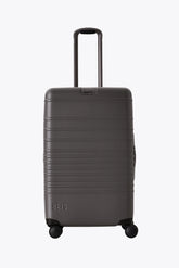 The Medium Check-In Roller in Charcoal