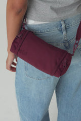 The Expandable Crossbody Charm in Burgundy